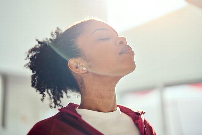 Lady breathing in deeply to clam herself